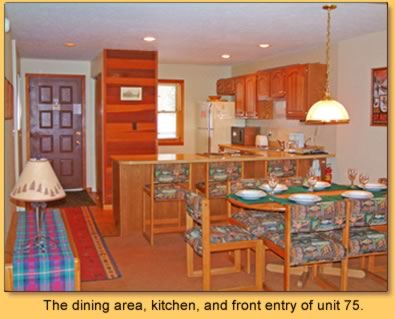 The dining area, kitchen, and front entry of unit 75.